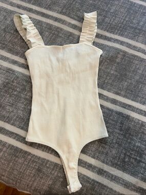 Ribbed Cream Girls One-Piece body suit with Ruffle Straps